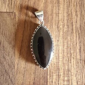 Marquise shaped black shell and silver vintage charm